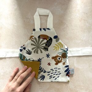 Tablier de poupée - Amazonie/moutarde